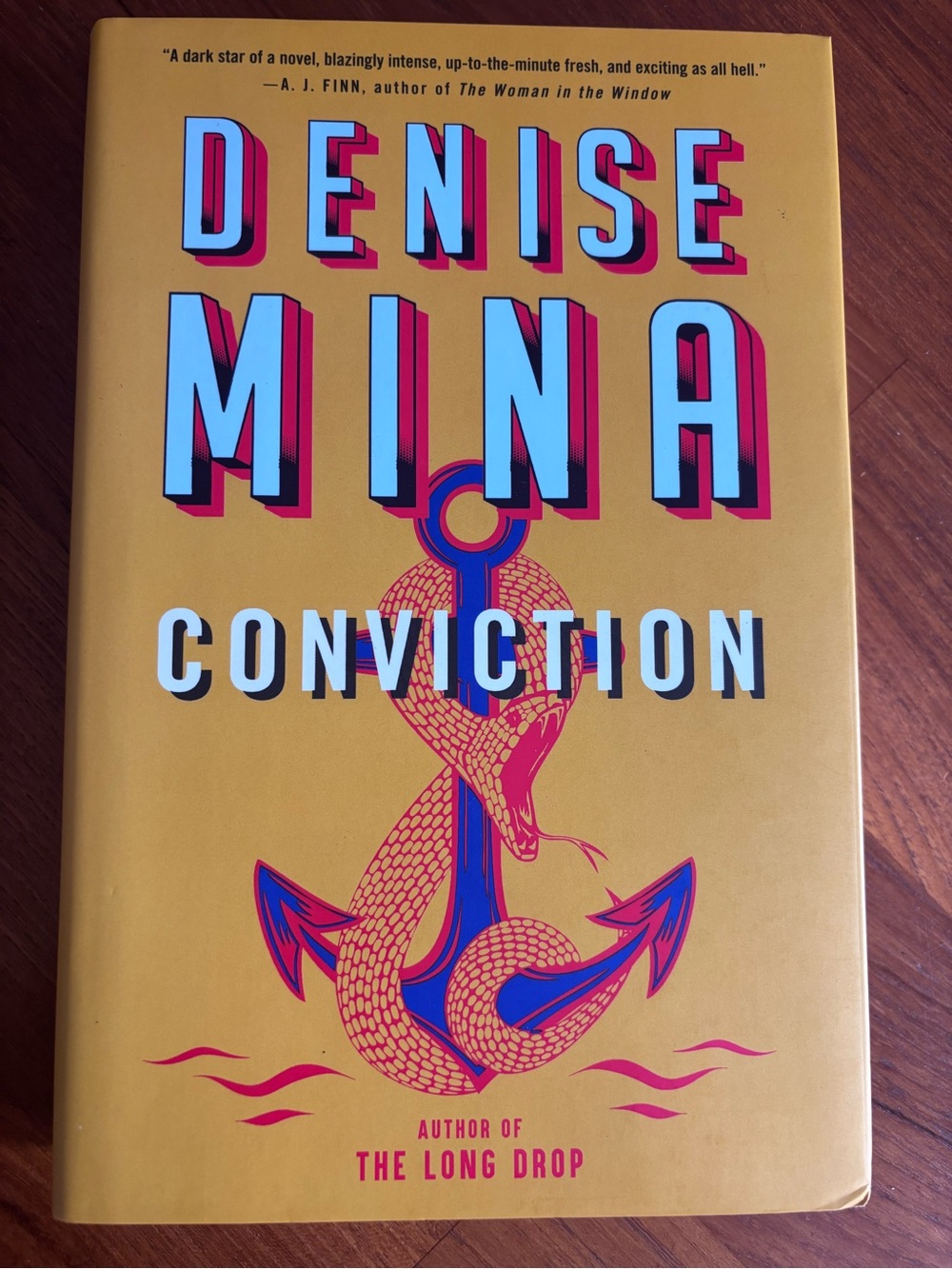 Denise Mina "Conviction" Hardcover - Yellow Cover with Blue & Pink Accents